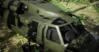 CGI Military helicopter parked in a forested area during daylight hours video