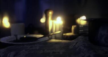 CGI Romantic dinner setting with candles and soft lighting in cozy room video