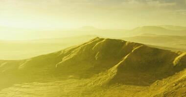 CGI Vast landscapes of rolling hills under a golden sunlight in a serene setting video