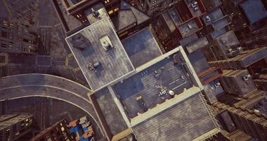 CGI View of urban rooftops and winding streets in city center during daylight hours video