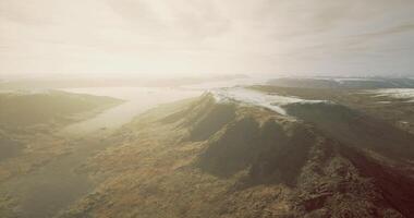 CGI A stunning panorama showcases majestic mountain ranges along a tranquil lake video