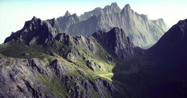 CGI Majestic mountains rising in early morning light with rugged terrain video