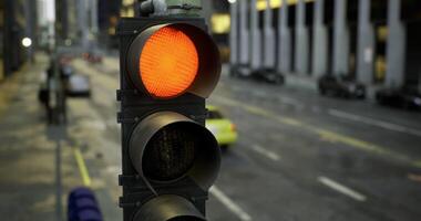 CGI Traffic signal displays red light on busy urban street in the afternoon video