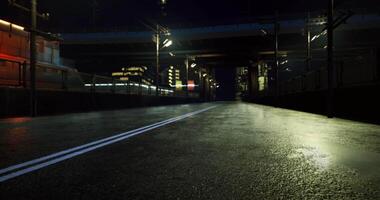 CGI Nighttime urban road under bridge with reflections and city lights video