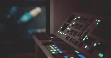 CGI Control panel with illuminated buttons in a dark room during late hours video