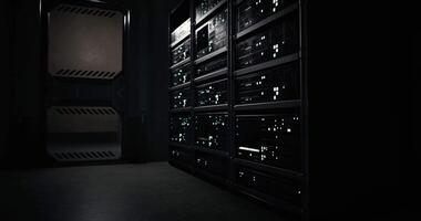 CGI High tech server room with illuminated racks during nighttime operation video