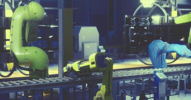 CGI Advanced robotics at work in a modern manufacturing facility during night shift video