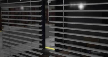 CGI Horizontal blinds filter light in a dark room creating a serene atmosphere video