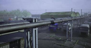 CGI Industrial site with trucks and large pipelines in cloudy weather conditions video