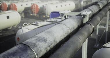 CGI Industrial pipeline system with storage tanks during daylight hours video