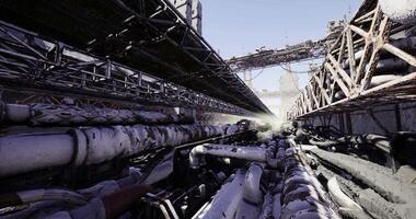 CGI Pipes and structures in a desolate industrial area during early morning light video
