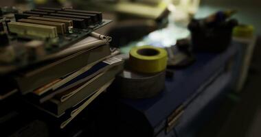 CGI Circuit boards and tools on a workbench during a late night electronics project video