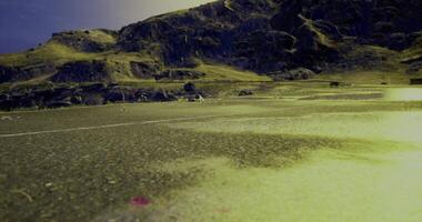 CGI Exploring a desolate road surrounded by rugged mountains during twilight video