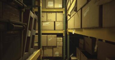 CGI Storage area filled with stacked boxes in a dimly lit warehouse environment video