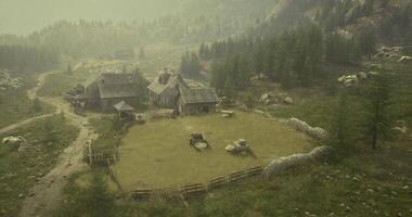 CGI Scenic rural landscape with a farmhouse surrounded by mountains and trees video