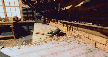 CGI Workshop tools and wood shavings in a rustic carpentry space at dusk video