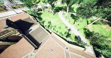 CGI Vibrant park pathway winding through lush greenery and urban architecture video