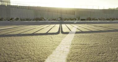 CGI Shadows cast over an empty parking lot during late afternoon light video