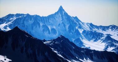 CGI Majestic snow covered mountain peak towering above surrounding ranges video