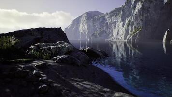CGI Tranquil Aussie dawn with rocky shoreline and water reflections video
