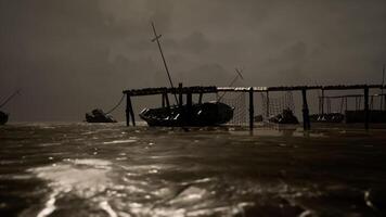 CGI Boats bobbing gently on dark waters under a moody sky at twilight video