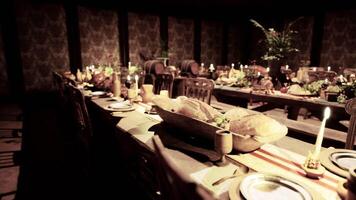 CGI A festive banquet table laden with various foods and drinks in a cozy setting video