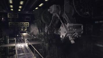 CGI Industrial machinery in an expansive factory setting with low lighting video