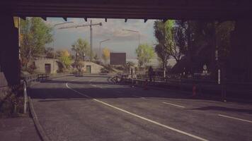 CGI Empty road under a bridge with trees and distant construction activity video