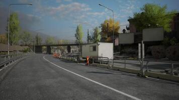 CGI Construction site near roadway with barriers and workers visible in daylight video