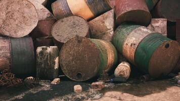 CGI Rusty barrels stacked in a disorganized manner near an industrial site video