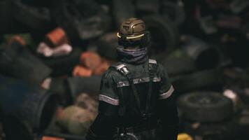 CGI Worker in protective gear surveys cluttered waste area during evening shift video