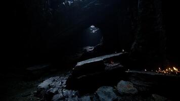 CGI Exploring a dark cave with faint light illuminating the rocky path video