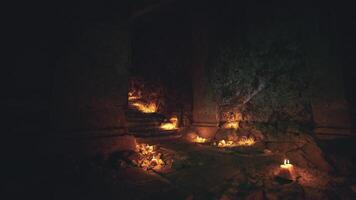 CGI Mysterious underground chamber illuminated by candles in dark environment video