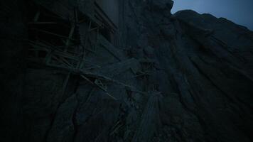 CGI Mysterious structure built on rugged mountain face at twilight video