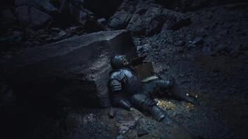 CGI Dead knight rests in a dark cave, surrounded by ancient relics and shadows video