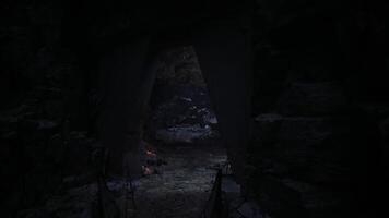CGI Exploring a mysterious dark cave with flickering firelight and rocky textures video