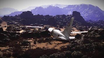 CGI Plane crash site in rugged terrain surrounded by rocky mountains video