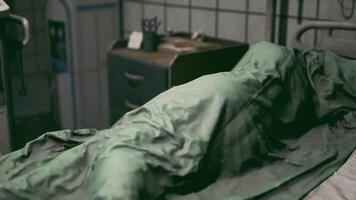 CGI Hospital bed with a patient covered in a green blanket during evening hours video