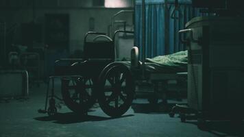 CGI Abandoned hospital room with an empty wheelchair in dim lighting at night video