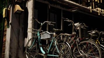 CGI Bicycles parked near a vintage building in an urban setting at dusk video
