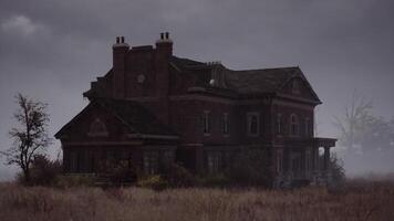 CGI Eerie mansion stands alone in foggy field on a gloomy day video