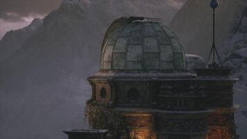 CGI Mountain observatory surrounded by snow capped peaks at dusk video