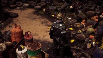 CGI Worker in protective gear surveying cluttered industrial site at dusk video