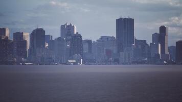 CGI View of a modern city skyline against a cloudy sky near the waterfront video
