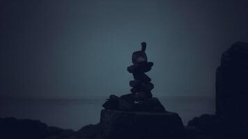 CGI Serenity at dusk with balanced stones near the shoreline video