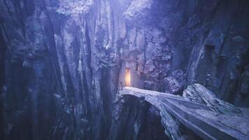 CGI Mysterious pathway leading to a glowing door in a rocky chasm video