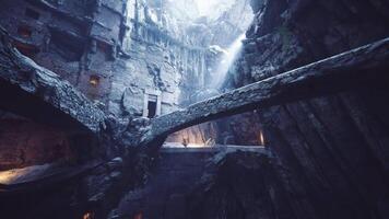CGI Exploration of ancient cave ruins illuminated by sunlight in a secluded valley video