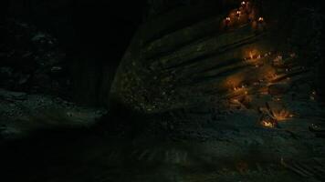 CGI Candlelit cavern with reflective water and illuminated rock formations video