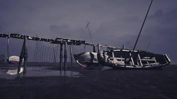 CGI Abandoned fishing boats docked at a desolate shore during twilight hours video