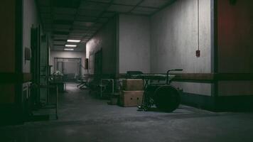 CGI Empty hospital corridor with scattered medical equipment in dim lighting video